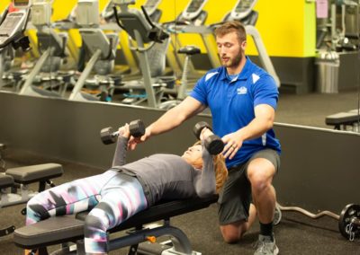 Personal Trainers coach on proper form and technique at Blue Moon Fitness